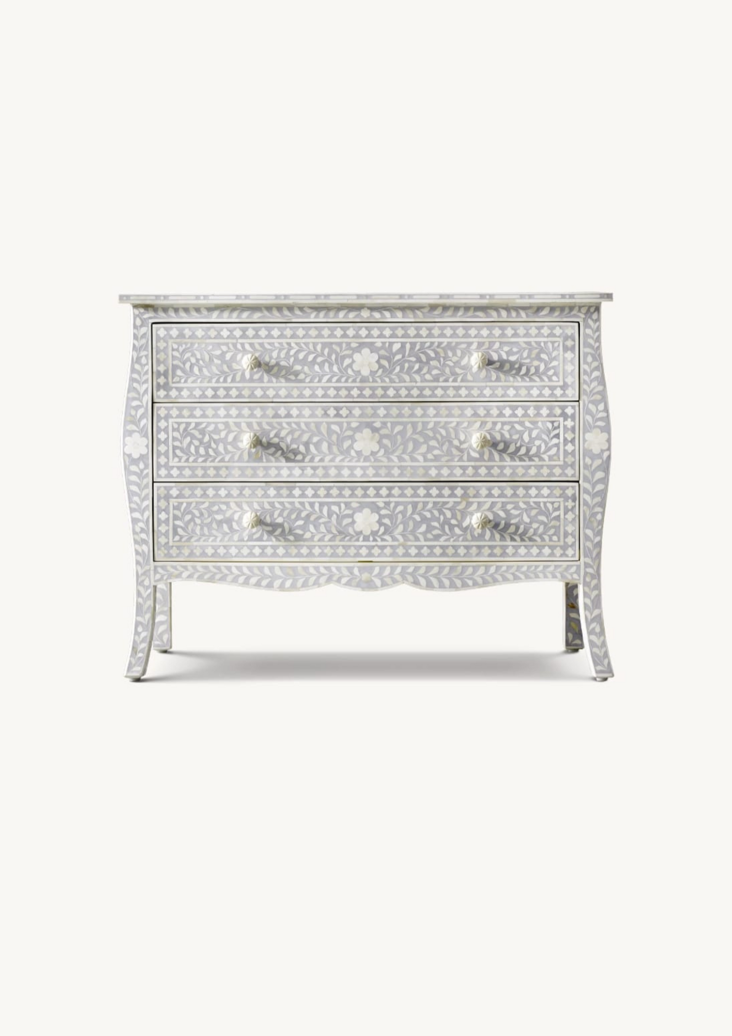 Decorative chest of drawers with bone inlay on a white background