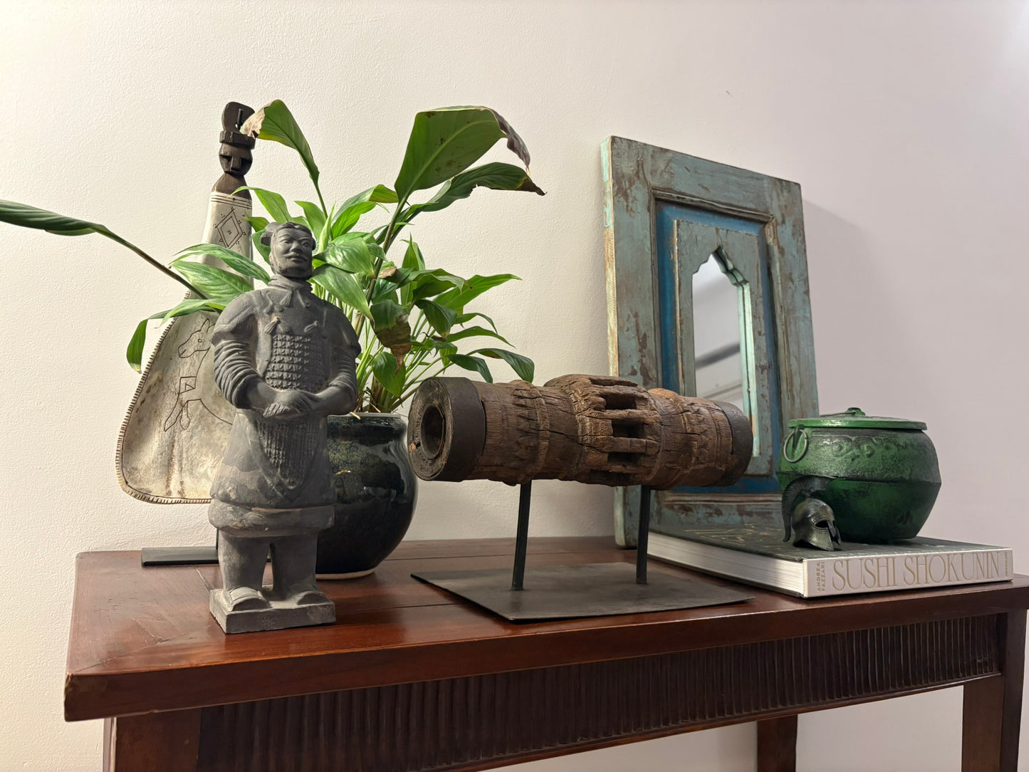 Vintage wooden carriage wheel hub from ancient India, repurposed into collectible decor with weathered, hand-carved details, showcasing sustainable craftsmanship by The Artisans Vault