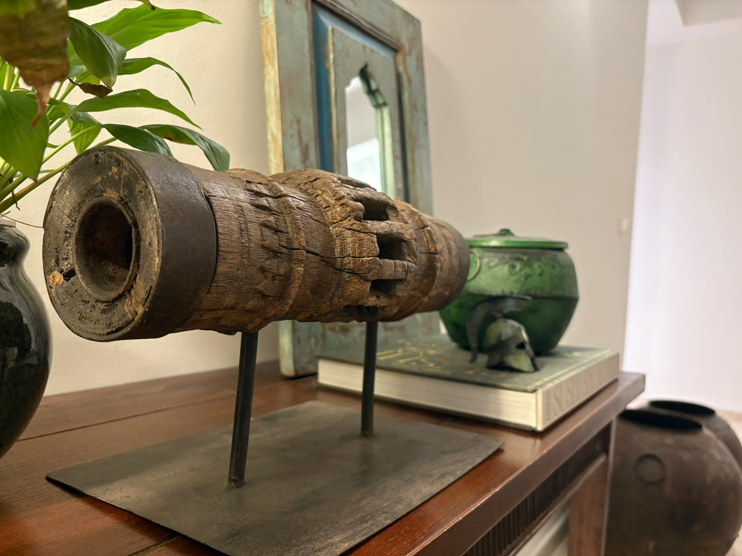 Vintage wooden carriage wheel hub from ancient India, repurposed into collectible decor with weathered, hand-carved details, showcasing sustainable craftsmanship by The Artisans Vault