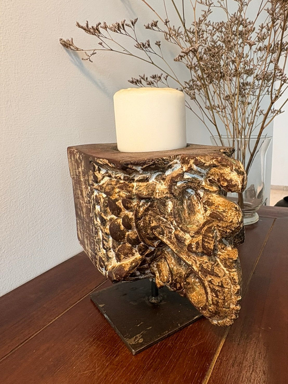 vintage Decorative candle holder with a lion head design on a wooden surface.