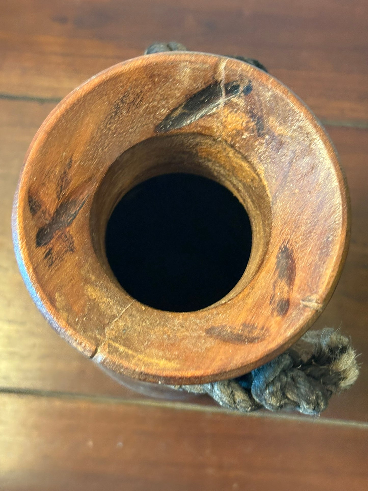 vintage Himalayan Wooden pot with a rope handle. top view