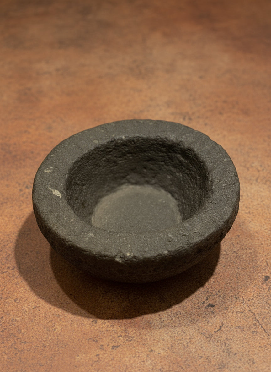 Vintage stone bowl on a brown surface