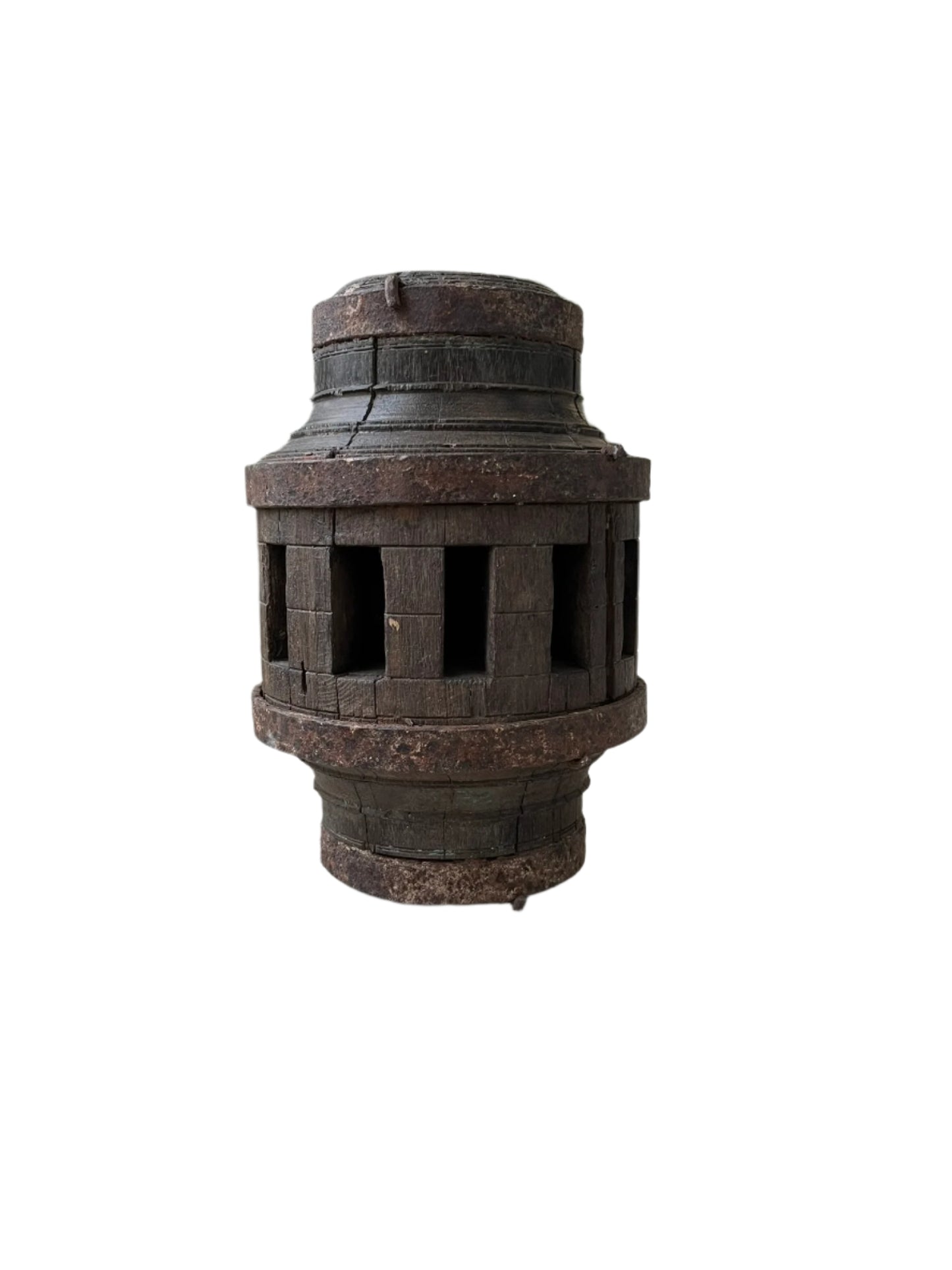 A vintage pulley candle stand made from weathered wood with a cylindrical shape and cut-out designs on the sides.