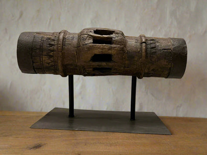 Vintage wooden carriage wheel hub from ancient India, repurposed into collectible decor with weathered, hand-carved details, showcasing sustainable craftsmanship by The Artisans Vault