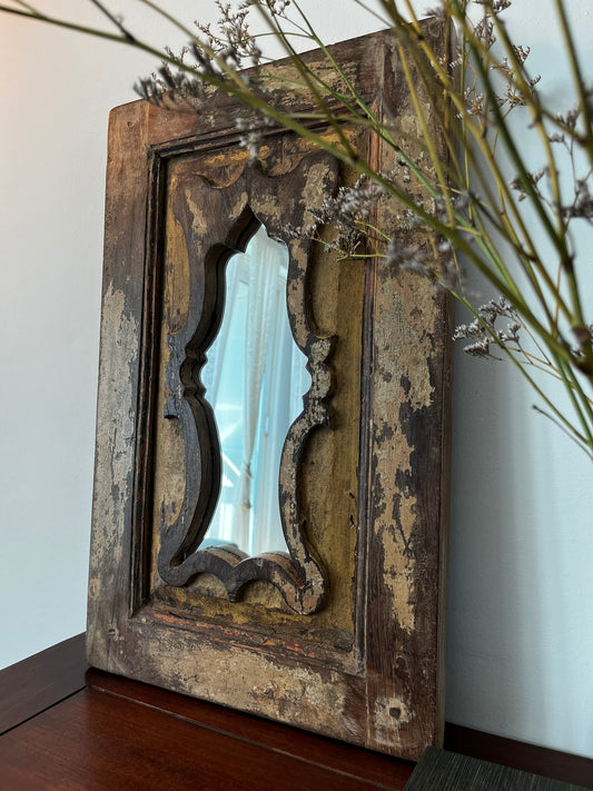 A vintage teakwood mirror with a decorative frame, featuring mirror within a mirror design, with hooks for hanging.