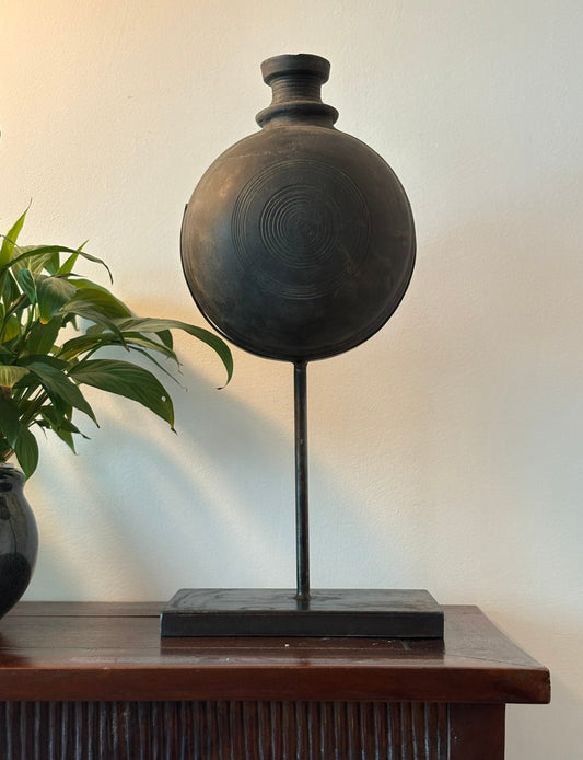 Handmade black pot on a stand 
