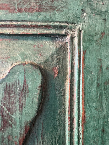 Close-up of an old wooden mirror frame with aged patina