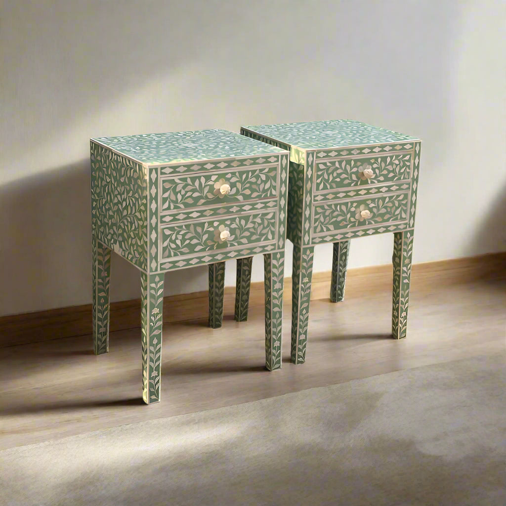 Two square side tables with intricate inlay patterns in green color on a light background.