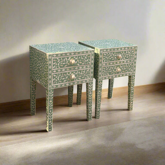 Two square side tables with intricate inlay patterns in green color on a light background.
