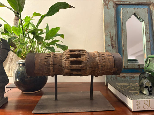 Vintage wooden carriage wheel hub from ancient India, repurposed into collectible decor with weathered, hand-carved details, showcasing sustainable craftsmanship by The Artisans Vault